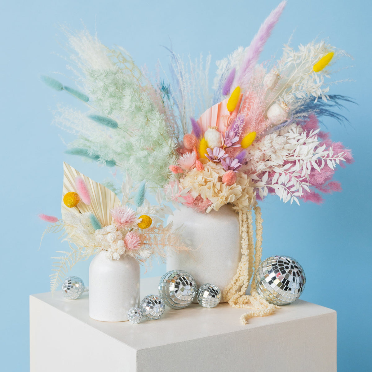 Dried flower stems including pampas grass and bunny tails at JJ's Flower Shop