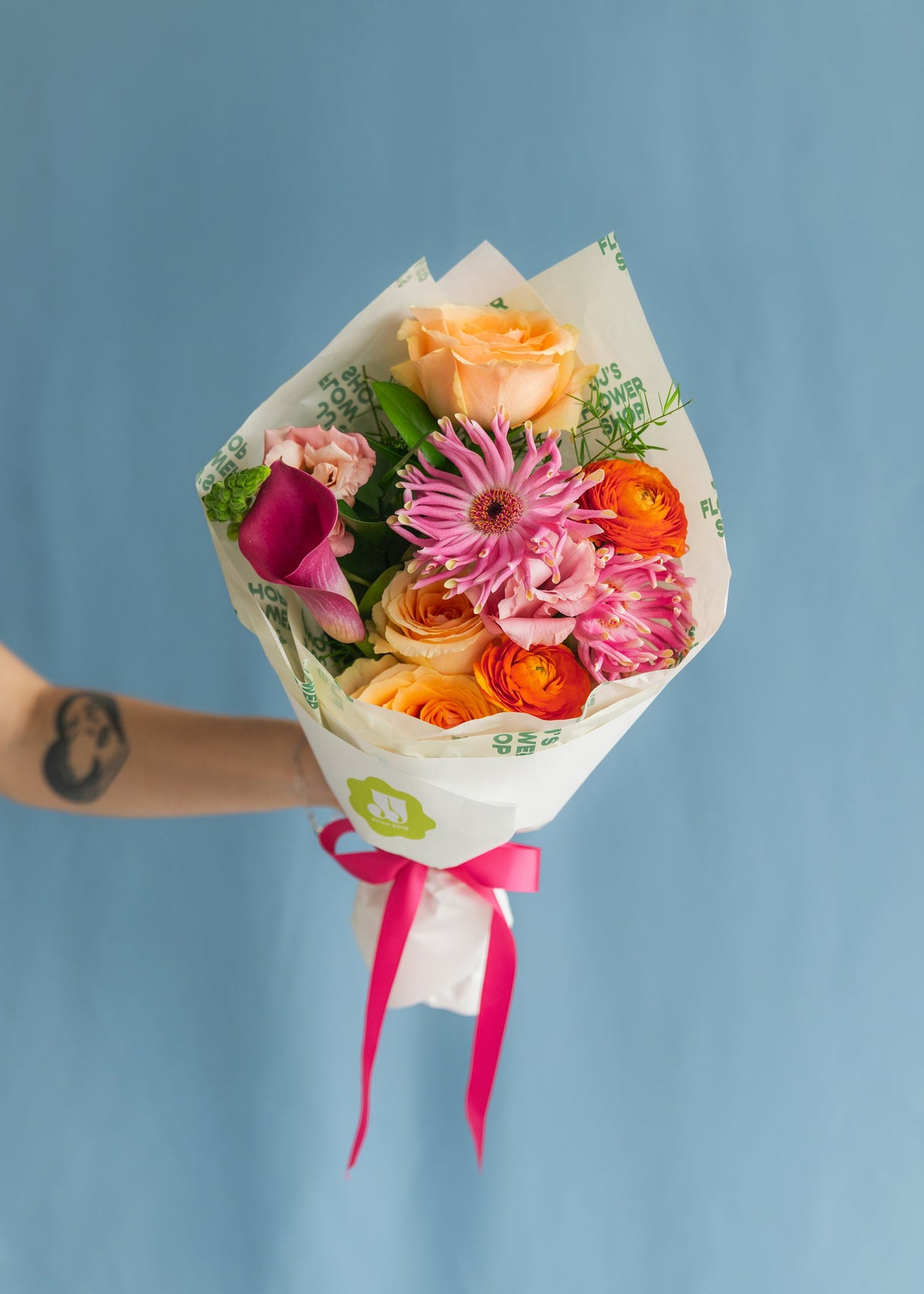 A hand-wrapped Midi bouquet from JJ's Flower Shop, the size most flower subscriptions start at